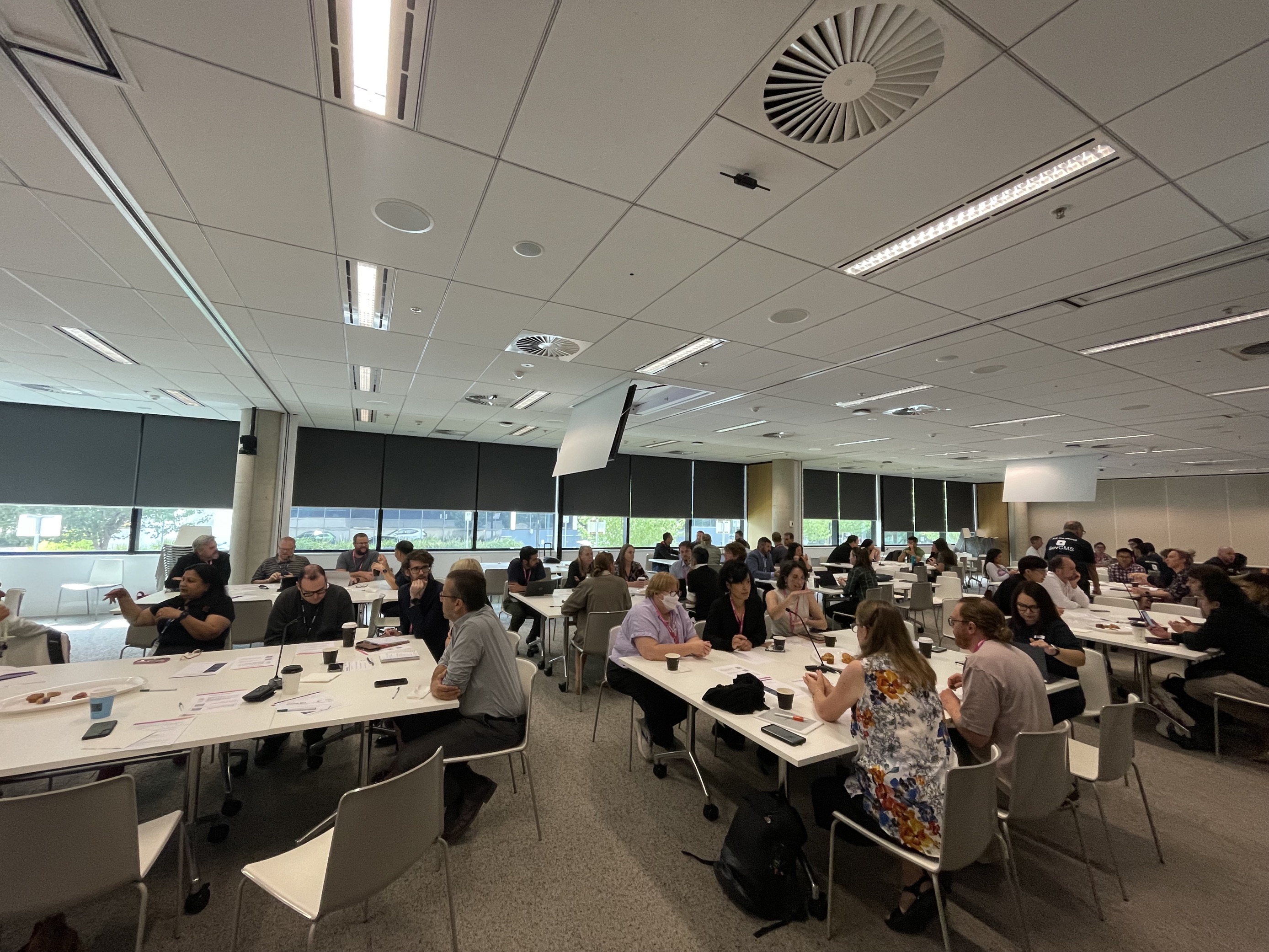 Photograph of March Mega Meetup attendees collaborating